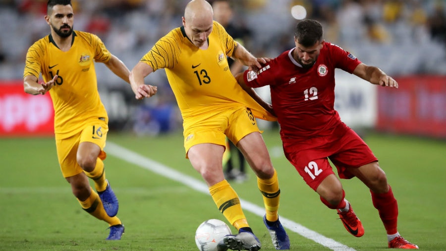 Aaron Mooy of Australia and Adnan Haidar of Lebanon compete for the ball during the International Friendly Match