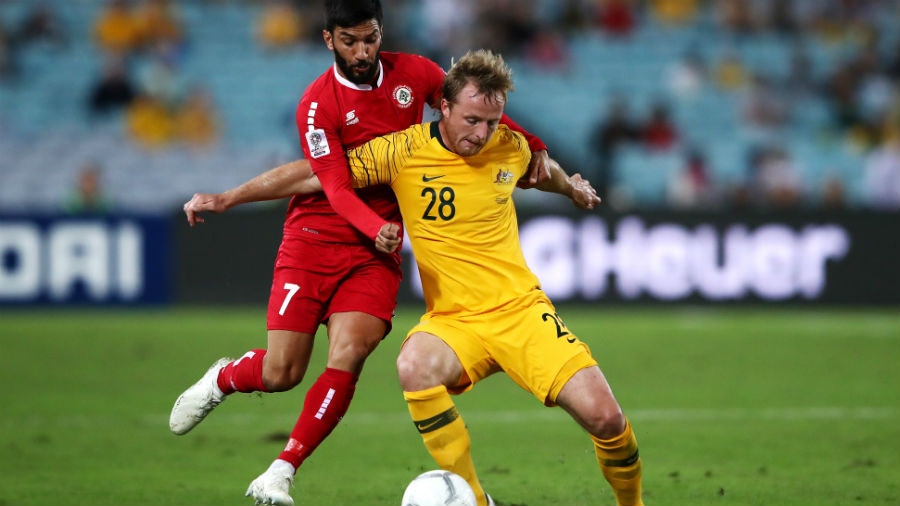 Rhyan Grant of Australia contests the ball with Hassan Maatouk of Lebanon during the International Friendly Match between the Australian Socceroos