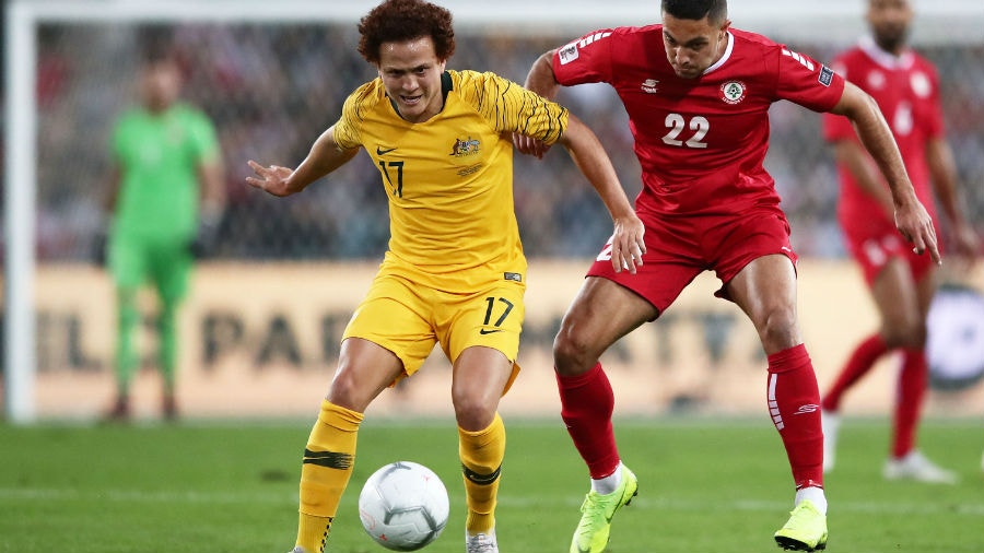 Mustafa Amini of Australia is challenged by Bassel Jradi of Lebanon during the International Friendly Match between the Australian Socceroos and Lebano