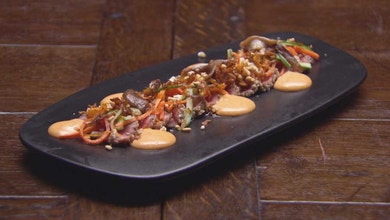 Sesame Beef Tataki with Gochujang Aioli, Pickled Vegetables, Puffed Rice and Carrot Chips