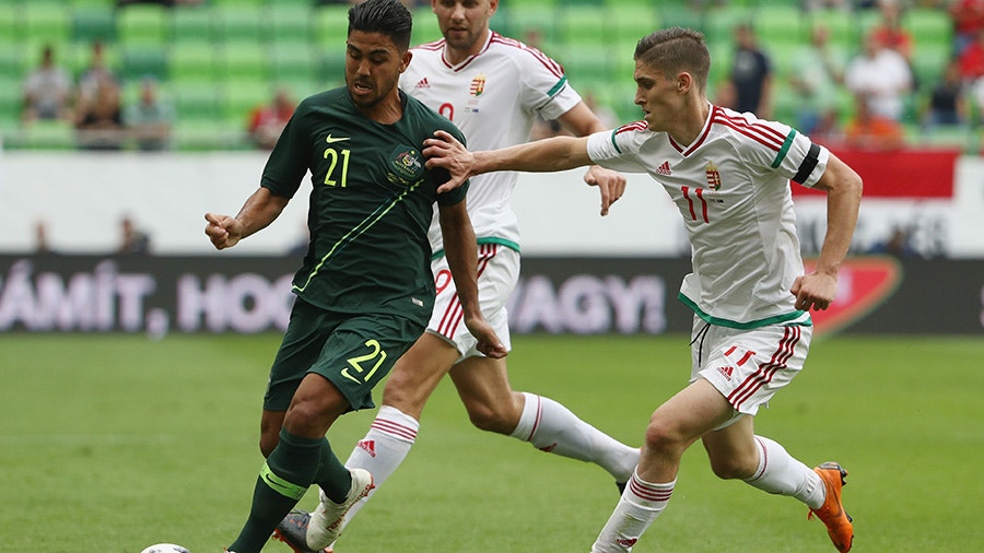 Massimo Luongo of Australia is chased by Roland Sallai of Hungary.