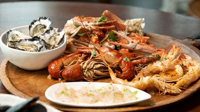Steamed Mussels, Fried Bugs, Oysters and Sashimi Snapper, Butterflied Prawns, Crab and Yabbies in Tom Yum Sauce