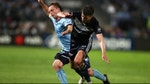 Rhyan Grant of Sydney FC is challenged by Terry Antonis of the Victory during the A-League Semi Final match between Sydney FC and the Melbourne Victory