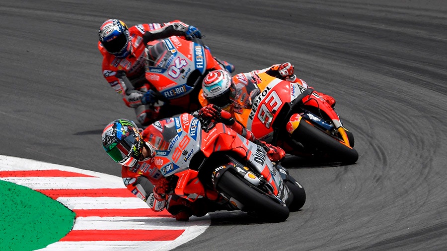 Ducati Teams Spanish rider Jorge Lorenzo Repsol Honda Teams Spanish rider Marc Marquez and Ducati Teams Italian rider Andrea Dovizioso.