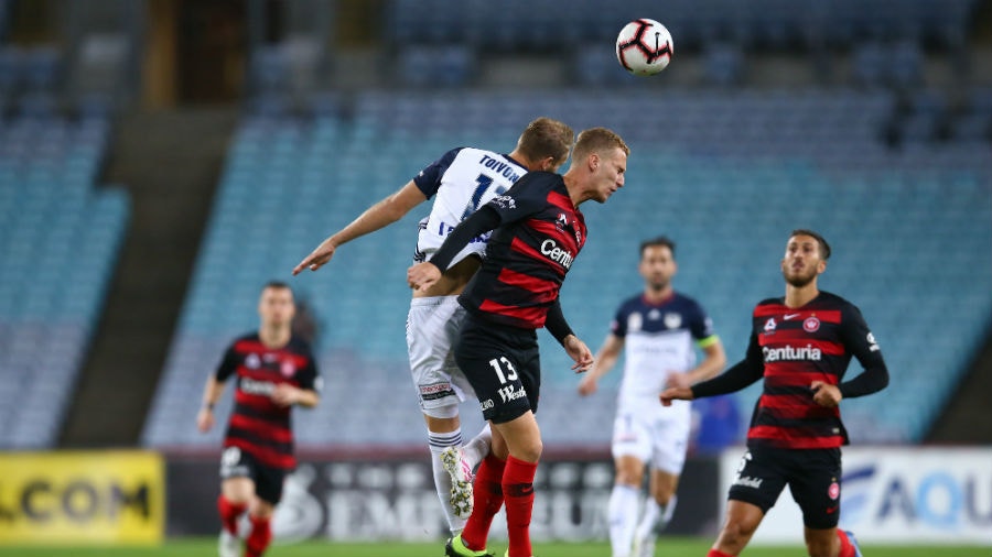 Tass Mourdoukoutas of the Wanderers and Ola Toivonen of the Victory compete for the ball during the round 27 A-League match