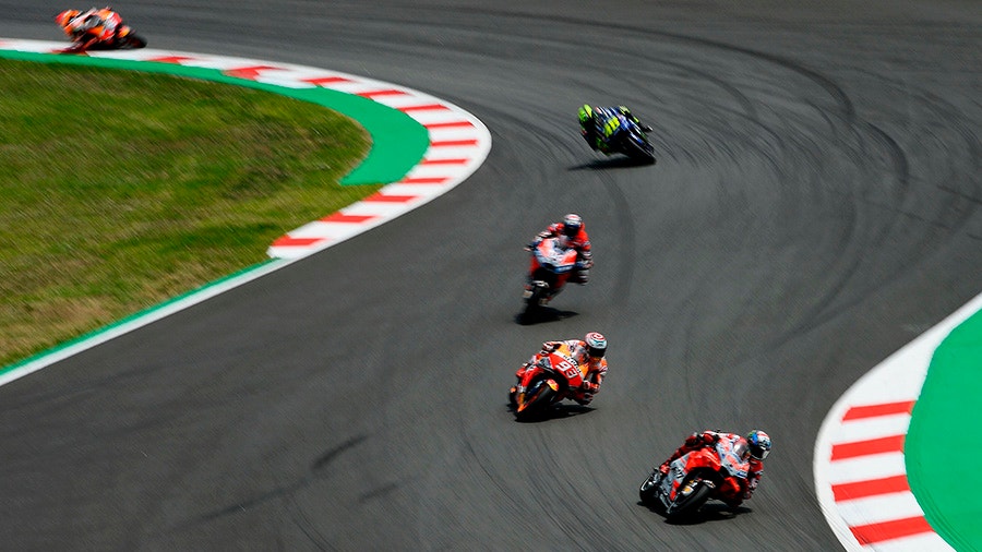 Ducati Teams Spanish rider Jorge Lorenzo rides ahead of Repsol Honda Teams Spanish rider Marc Marquez.