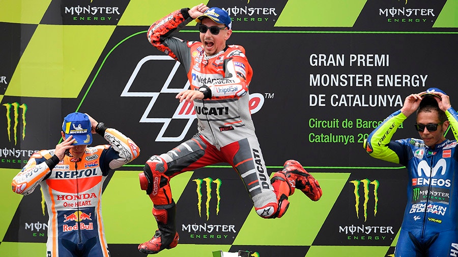 Ducati Teams Spanish rider Jorge Lorenzo celebrates on the podium.