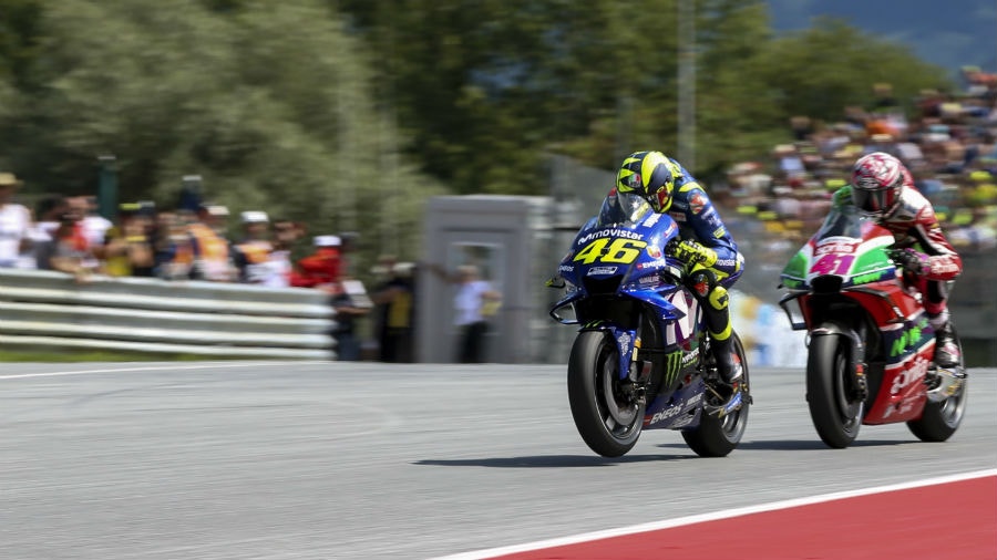 Valentino Rossi of Italy and Movistar Yamaha MotoGP and Aleix Espargaro of Spain and Aprilia Racing Team Gresini