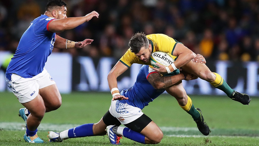 Adam Ashley-Cooper of the Wallabies tackled