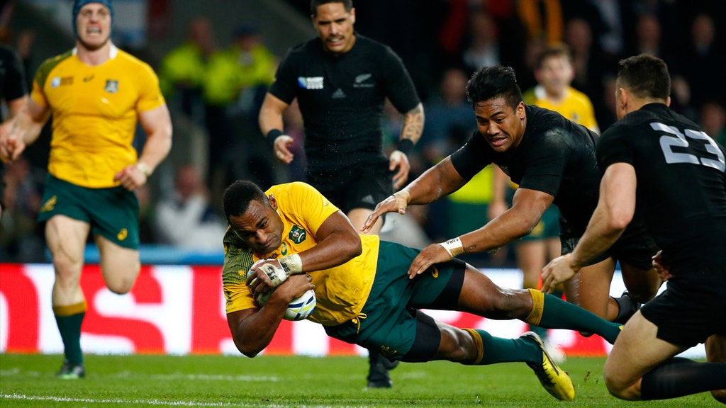 Tevita Kuridrani of Australia dives over the line to score