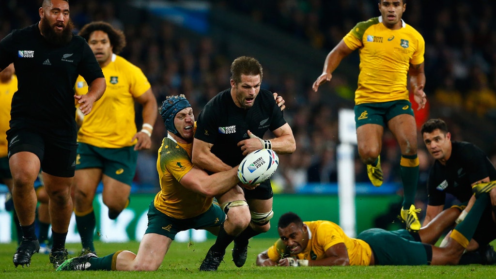 Richie McCaw of New Zealand loses the ball