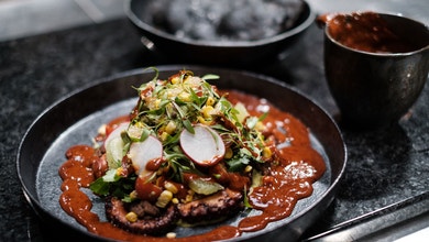 Grilled Octopus with Chipotle Chilli Sauce, Frijoles Negros, Guacamole, Corn Salsa and Tostada