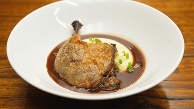 Confit Duck Leg with Smoked Potato Puree and Braised Cabbage
