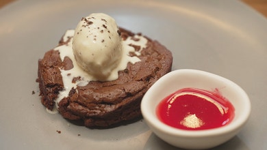 Flourless Chocolate Cake with Vanilla Bean Ice Cream and Raspberry Coulis