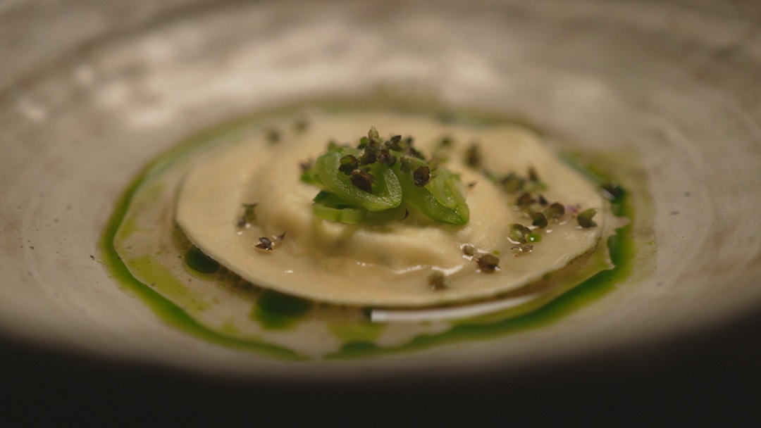 Ricotta and Basil Raviolo with Vegetable Broth and Blue Spiced Basil Oil