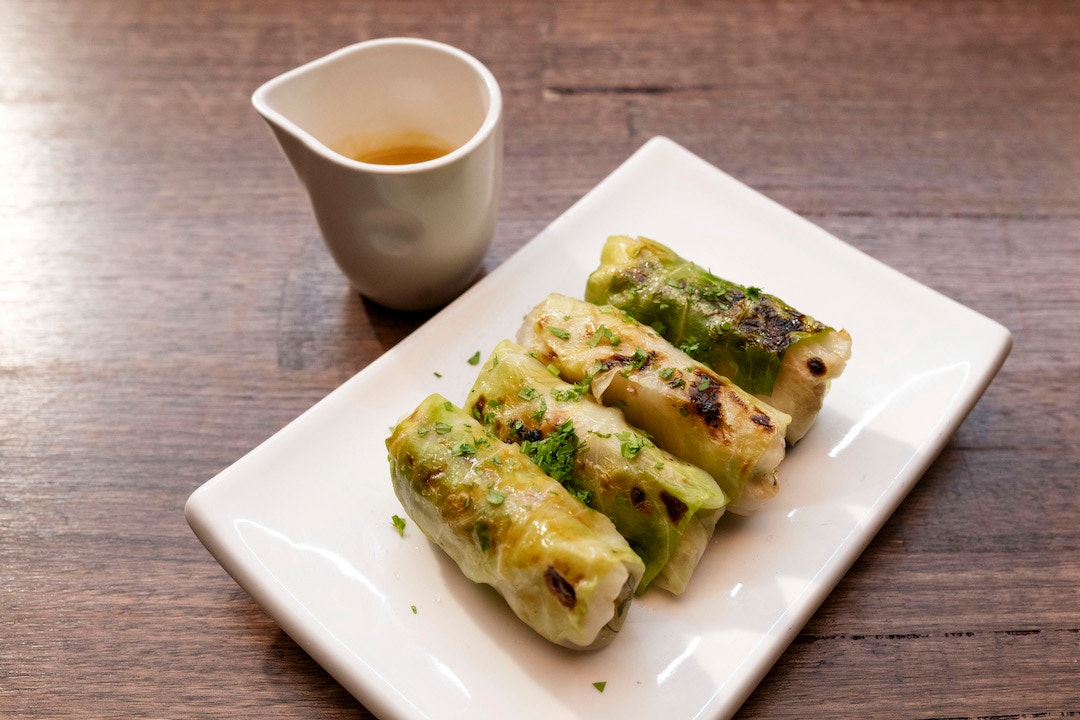 Spatchcock, Pineapple and Turnip Cabbage Rolls with Baby Mandarin Sauce