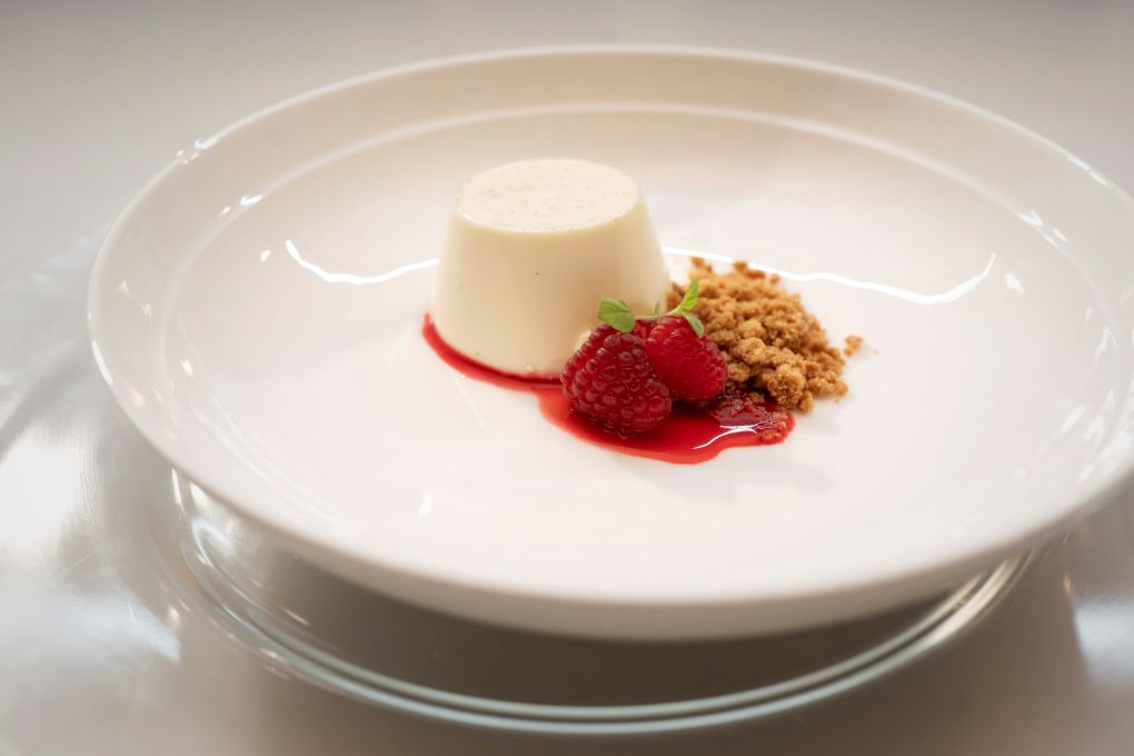 Vanilla and Honey Panna Cotta with Crumb and Raspberry Coulis