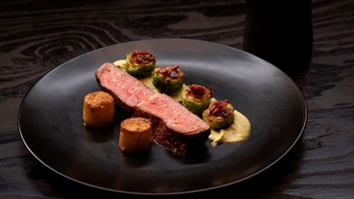 Rib Eye Steak With Brussel Sprout Purée And Roasted With Maple And Prosciutto Crumb, Fondant Potato And Peppercorn Sauce